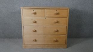 A Victorian pine chest of drawers on plinth base. H.95 W.107 D.47cm