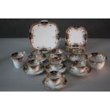 A Roslyn china seven person part tea set. Decorated with a floral design. Includes cups and saucers,