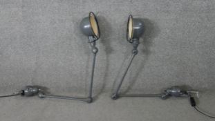 A pair of 1950's Jean Louis Domeq for Jielde, French grey industrial extendable table lights.