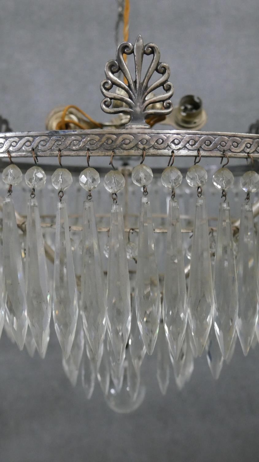 An early 20th century French silver plated crystal drop three tier waterfall chandelier, with four - Image 6 of 8