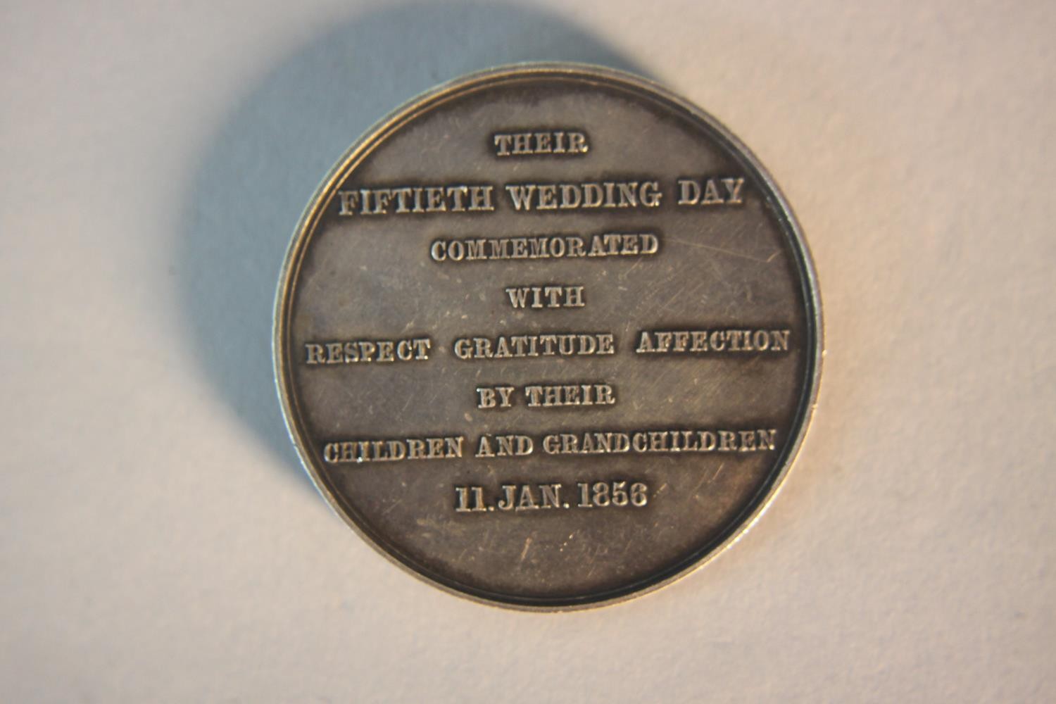 A 19th century 50th wedding day celebration silver medal. Celebrating the marriage of J. Frederick - Image 4 of 6