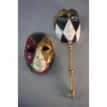 Two bespoke Ca' del Sol Venetian masks, each with a harlequin design, one with a gilded turned