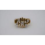 A mid century Brutalist design 18 carat yellow gold ring. Set with five round brilliant cut diamonds