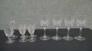 A collection of ten crystal glasses. Two sets of four cut crystal sherry glasses one set with