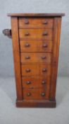 A Victorian walnut Wellington chest of seven drawers with locking stile fitted with candle slide and