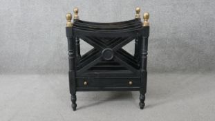 An ebonised 19th century style Canterbury with brass finials. H.51 W.47 D.37CM