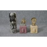 A carved Chinese soapstone chop in the form of an immortal along with two Indian brass deities on