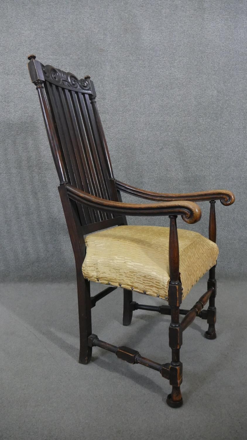A 19th century oak Carolean style armchair with scroll cresting to the back rail and raised on - Image 5 of 5