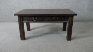 A low table fitted with frieze drawers on square tapering supports. H.51 W.101 D.61cm