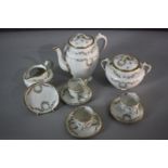 A French GDA Limoges porcelain four person coffee set. (one cup missing). Decorated with floral