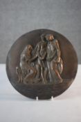 A 19th century relief bronze plaque with Classical figural design. Unsigned. Dia.27cm.