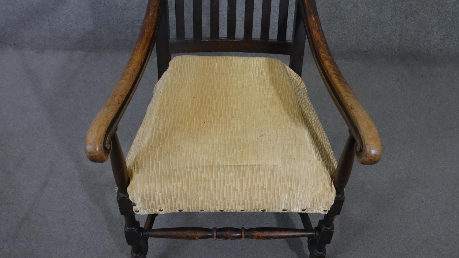 A 19th century oak Carolean style armchair with scroll cresting to the back rail and raised on - Image 2 of 5