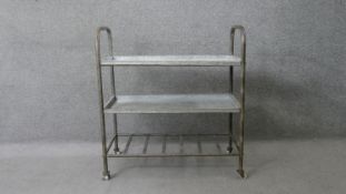 A vintage industrial style zinc and tubular metal trolley with three tiers. H.87 W.80 D.39cm