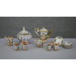 A vintage Capodimonte relief design six person ceramic coffee set with putti design and a lidded