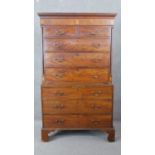 A Georgian mahogany chest on chest the dentil carved cornice above two short and three long