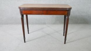 A late Georgian mahogany and Greek key motif ebony strung tea table with double gateleg reeded