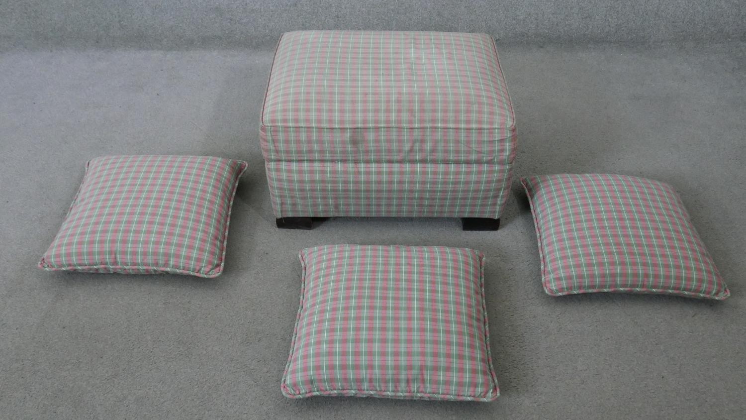 A contemporary upholstered footstool with matching cushions. H.33 W.64 D.50CM (largest)