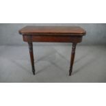 A 19th century mahogany foldover top tea table on gateleg turned tapering supports. H.75 W.90 D.45cm