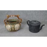 A 19th century Alhambrian majolica basket with branch handle along with a Basalt Wedgwood teapot