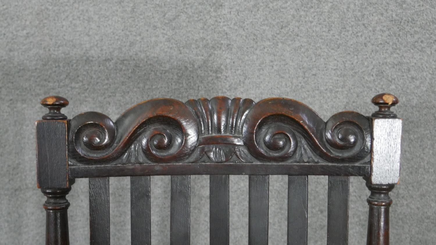 A 19th century oak Carolean style armchair with scroll cresting to the back rail and raised on - Image 4 of 5