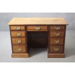 A 19th century ash pedestal desk with an arrangement of nine drawers on plinth base. H.80 W.122 D.54