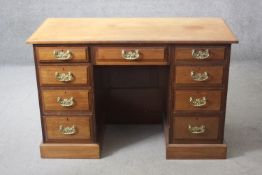 A 19th century ash pedestal desk with an arrangement of nine drawers on plinth base. H.80 W.122 D.54