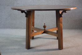 A contemporary Cherrywood strung dining table on square cross stretchered supports.