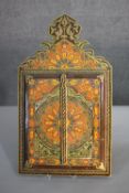 An Indian lacquered and hand painted mirror with opening doors. Decorated with a stylised floral