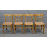 A set of four vintage beech kitchen chairs.