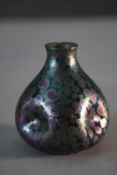 An Art Nouveau Golfe Juan lustre ceramic vase with pinched design and comma pattern to the exterior.
