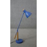 A Made.com blue anglepoise style desk lamp with beech detailing. H.66 W.67CM (extended)