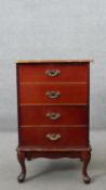 A Georgian style mahogany filing cabinet with lift up section above drawer on cabriole supports. H.