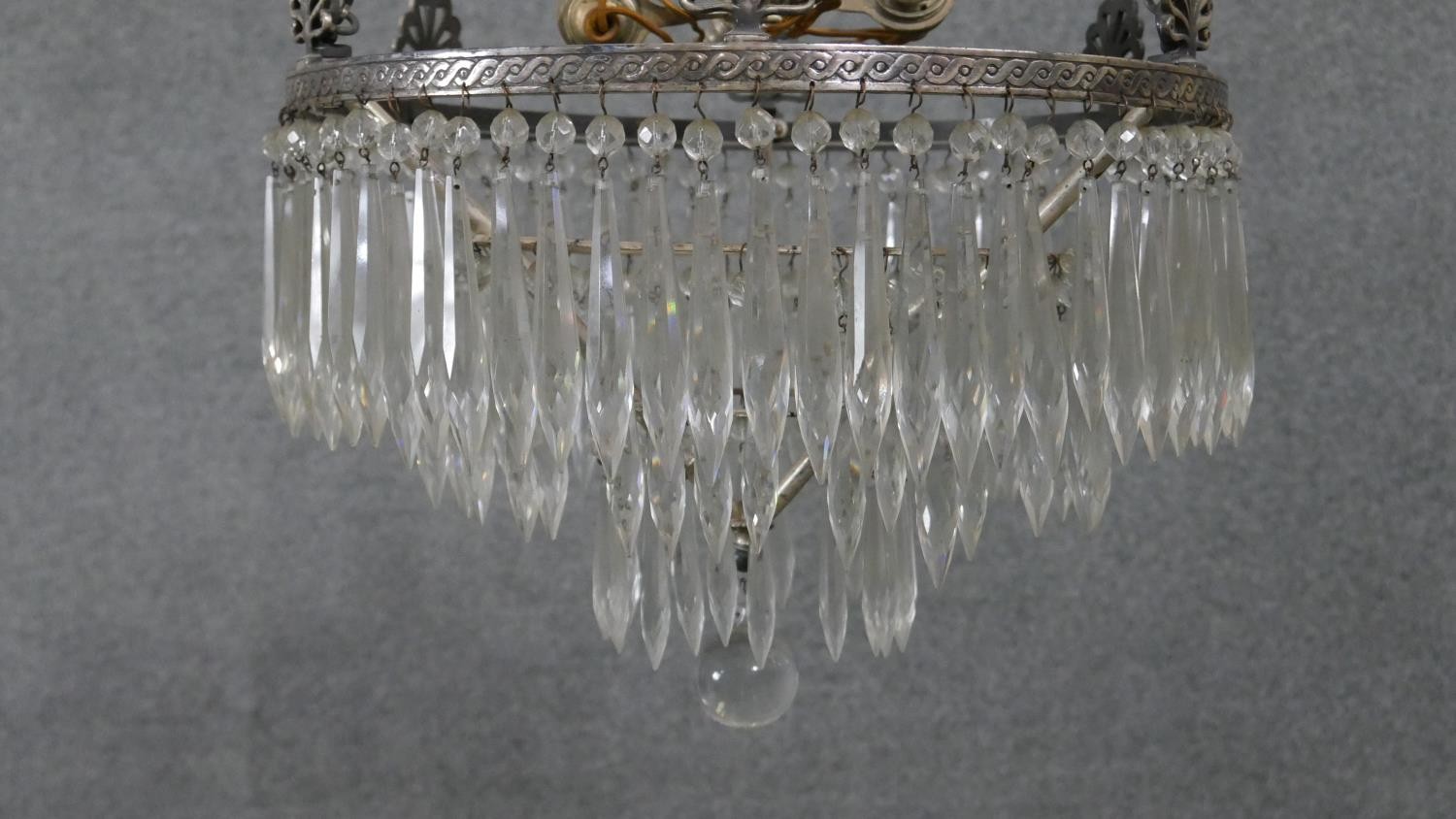 An early 20th century French silver plated crystal drop three tier waterfall chandelier, with four - Image 2 of 8