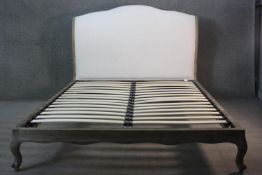 A French Provincial style limed oak Sleep Room bedstead, to take a 4'6" mattress.