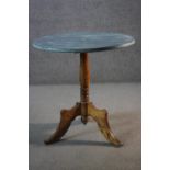 A 19th century birch tripod occasional table with distressed painted top. H.75 Dia.cm