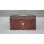 A vintage red leather effect lockable travelling jewellery casket with blue velvet interior and