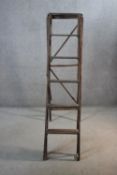 A set of vintage folding library step ladders. H.165 cm.