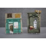 Two vintage relief hand painted ceramic plaques one modelled as the front of a French bakery the