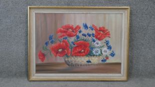 A framed oil on canvas still life of poppies and other flowers. Signed B. Storz. H.58 W.79 cm