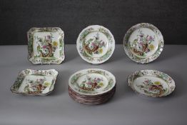 A part Spode peacock design dinner service. Includes nine dinner plates, two serving dishes and