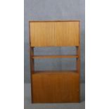 A vintage teak G-Plan wall unit with cupboards and open shelves. H.127 W.76 D.26CM