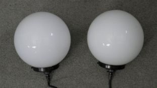 A pair of vintage style ceiling pendant lights with white opaque glass globe shades. H.23 W.19 cm