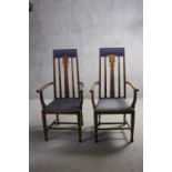 A pair of late 19th century oak armchairs with Art Nouveau tulip motif carved back splats.