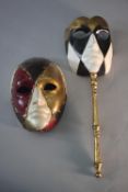 Two bespoke Ca' del Sol Venetian masks, each with a harlequin design, one with a gilded turned