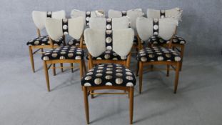 A set of eight mid century teak Vanson dining chairs, maker's label to the underside. Original horse