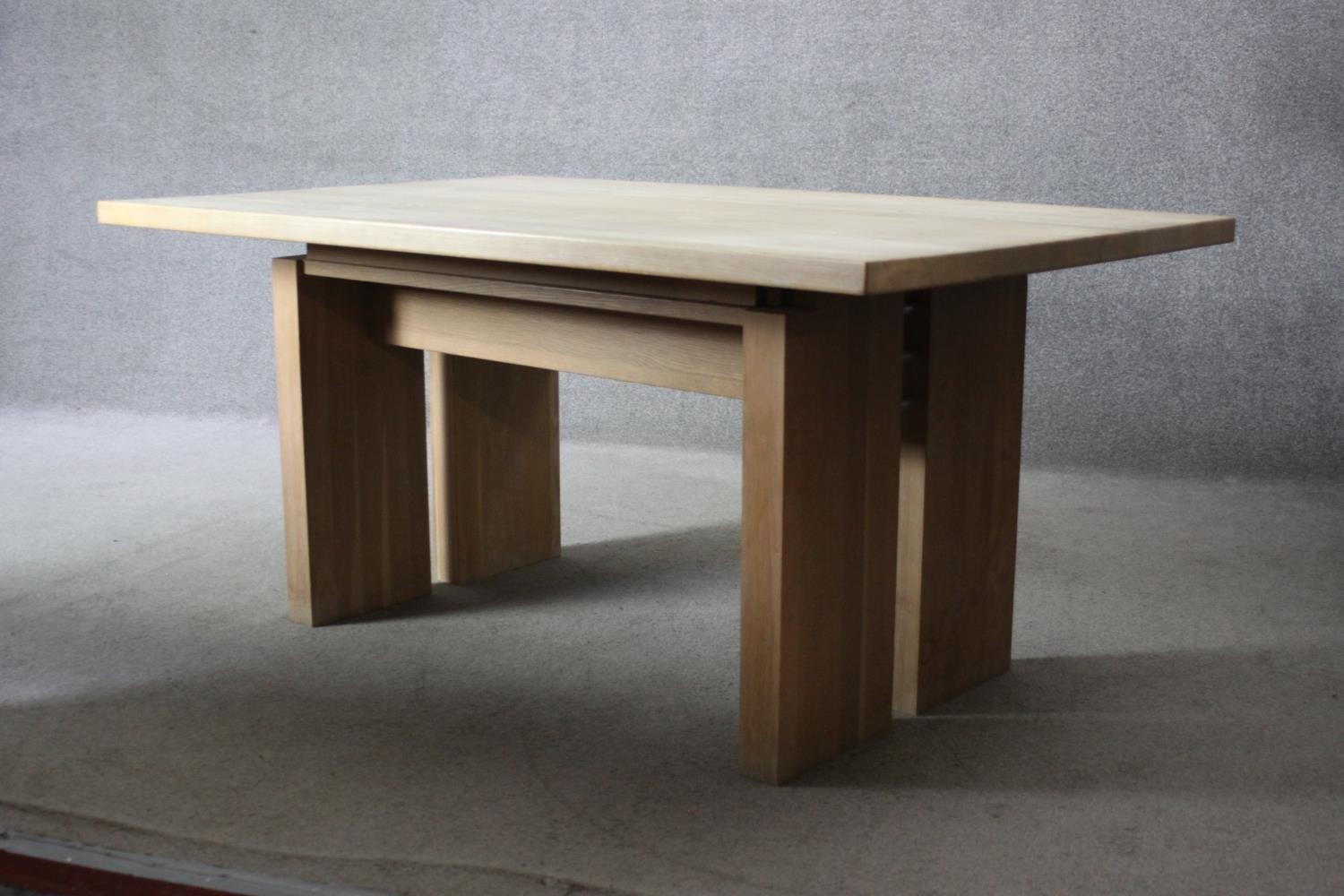 A contemporary light oak planked top dining table on block supports. H.74 W.160 D.100 cm. - Image 4 of 7