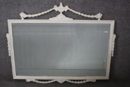 An early 20th century painted wall mirror with Adam style urn and husk cresting and etched plate