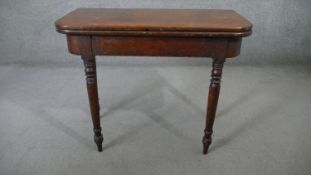 A 19th century mahogany foldover top tea table on gateleg turned tapering supports. H.75 W.90 D.45cm