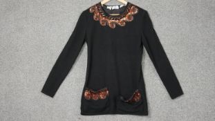 A vintage Valentino woolen long jumper with sequin embellishment. Around the neck and on the two