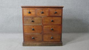 A Victorian mahogany chest with an arrangement of nine drawers on plinth base. H.79 W.81 D.53cm